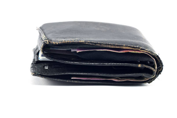 Old black leather wallet isolated on a white background
