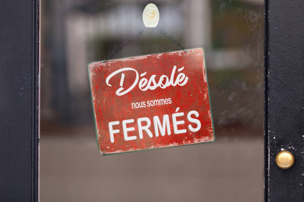 Sorry, we are closed - Closed sign Blue open sign with written in it in French: "Désolé, nous sommes fermés", meaning in English "Sorry, we're closed". french language photos stock pictures, royalty-free photos & images