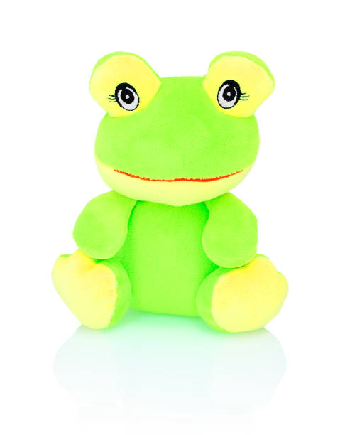 istock Neon green frog plushie toy isolated on white background with shadow reflection. Chartreuse frog doll isolated on white underlay. Plush stuffed puppet on white backdrop. Green and yellow tree frog. 1045872638