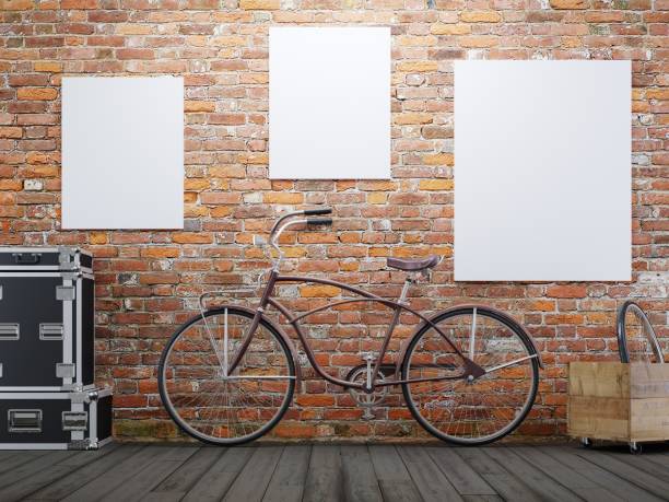 istock mock up poster and canvas in vintage hipster loft exterior background with bicycle 1045877314