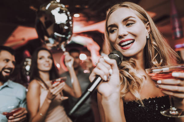istock Sing and Drink. Black Dress. Have Fun.Celebration. 1045879502