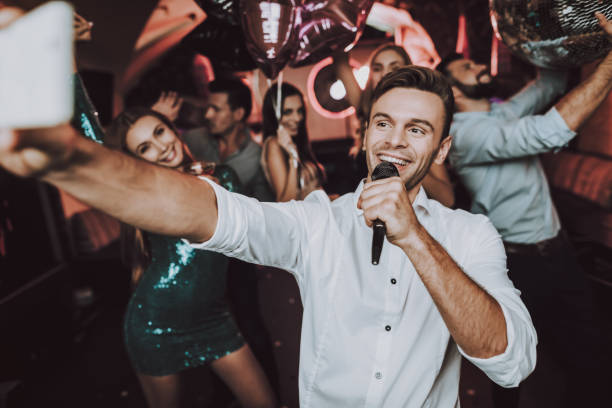 istock Have Fun. Great Mood. Sing in Karaoke.Party Maker. 1045879512