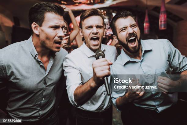 Men Sing Boys Great Mood Young People Birthday Stock Photo - Download Image Now