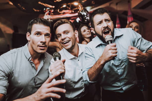 istock Sing. Microphone. Trendy Modern Nightclub. Boys. 1045879674