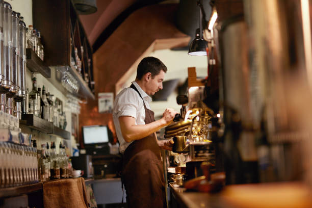 istock Barista Preparing Coffee In Coffee Shop 1045880562