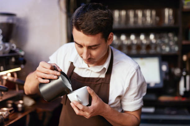 istock Barista Preparing Coffee In Cup At Cafe 1045880812