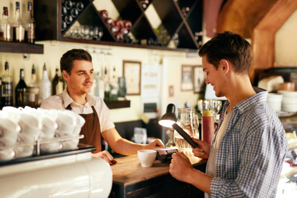 istock Customer Paying With Mobile Phone In Cafe 1045883686