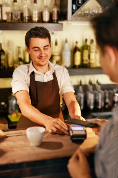 istock Customer Paying With Mobile Phone In Cafe 1045883718