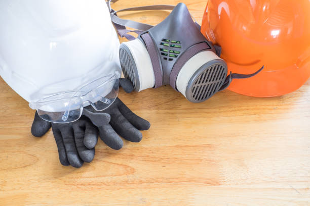 istock Standard personal protective equipment on wooden table. top view, concept safety 1045883864