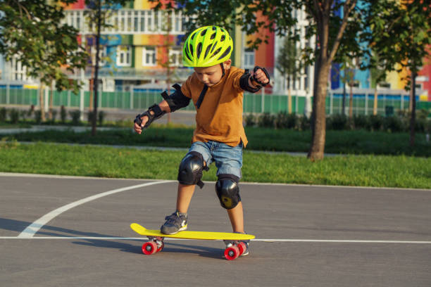 istock A little boy enjoys a yellow cruiser penny plastboard 1045886528