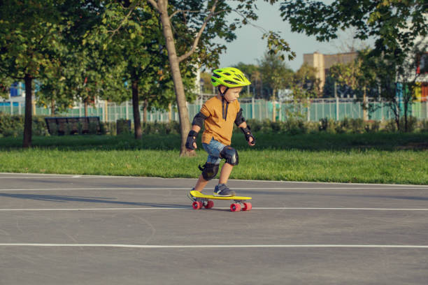 istock A little boy enjoys a yellow cruiser penny plastboard 1045886534