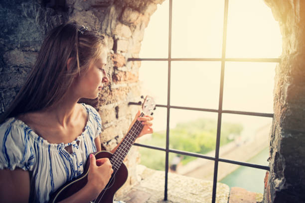 Princess playing music in the castle tower
