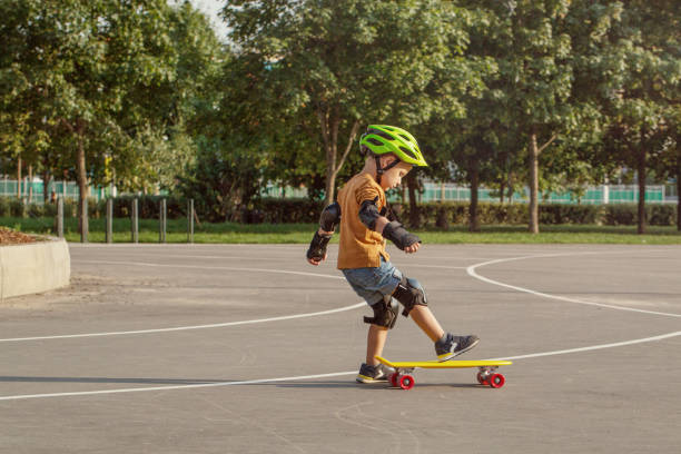 istock A little boy enjoys a yellow cruiser penny plastboard 1045886668