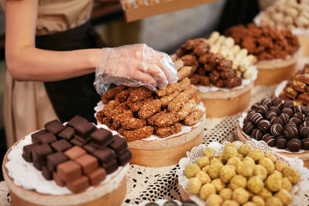 istock Chocolate Store. Chocolate Sweets On Shelves In Shop 1045890102