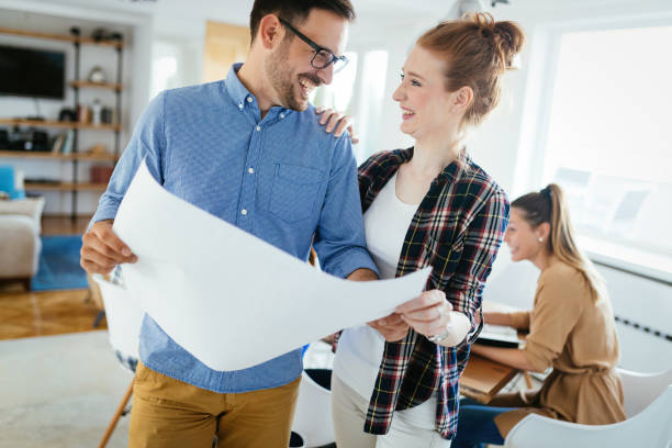 istock Group of young business people and architects working on project 1045890860