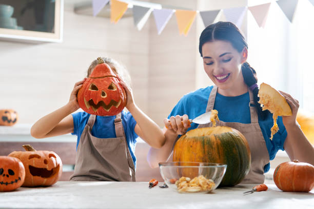 istock family preparing for Halloween. 1045899746
