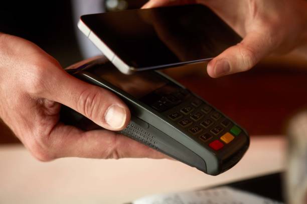 istock Contactless payment with smart phone 1045900434