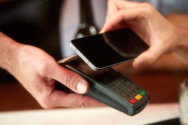 istock Contactless payment with smart phone 1045900464