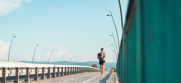 istock Young woman jogging 1045905886