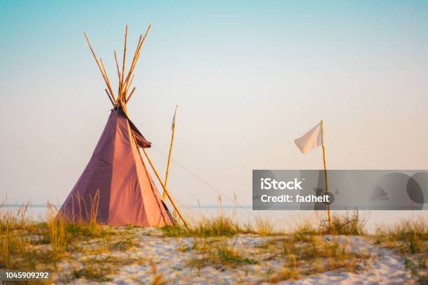 A Photo Of A Tipi Stock Photo - Download Image Now - American Culture, Architecture, Beach