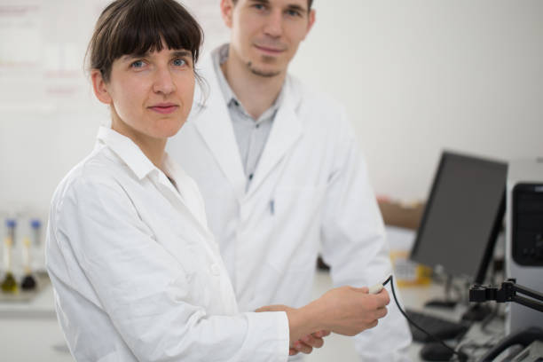 istock Colleagues in the research Laboratory examining experiment results 1045909404