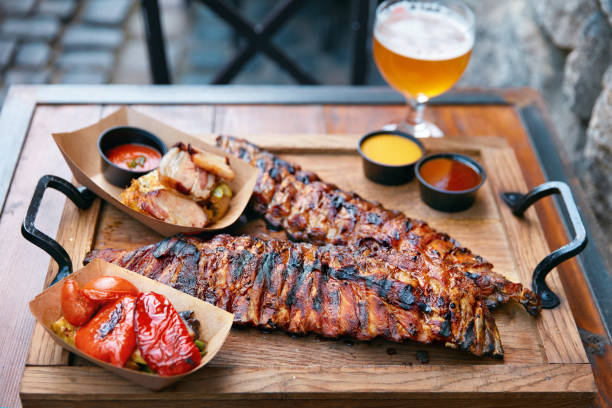istock Barbecue Ribs And Beer On Table In Restaurant Closeup 1045909862