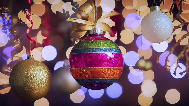 Dolly shot of Christmas lights and hanging decoration. Holiday backgrounds