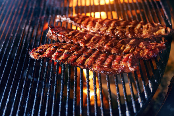 istock Pork Ribs Cooking On Grill Closeup 1045921300