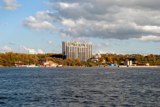 istock Construction of a multi-storey house on the river Bank 1045929214