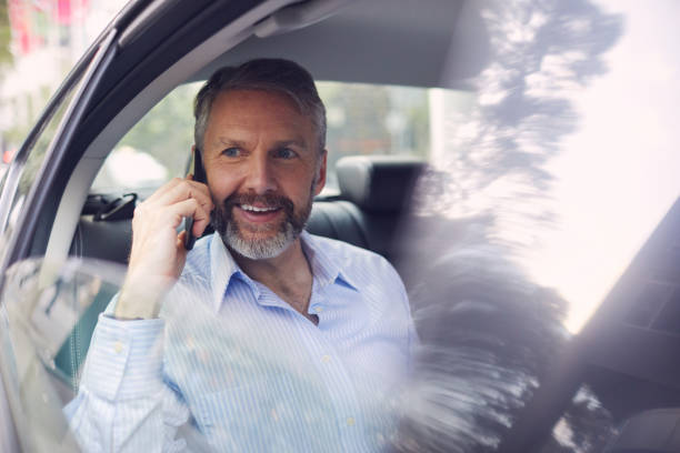 istock Business on the move, riding a car. 1045935128