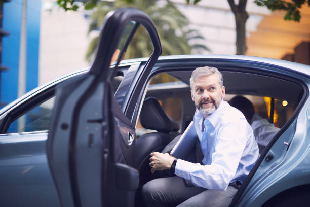 istock Business on the move, riding a car. 1045935132
