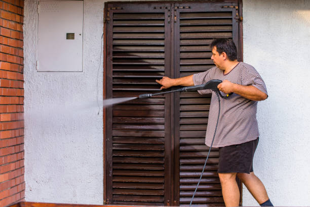 istock Man Cleaning House with Water Spray 1045941204