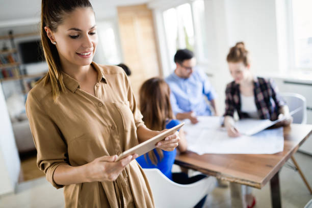 istock Creative young business people and architects working in office 1045942644