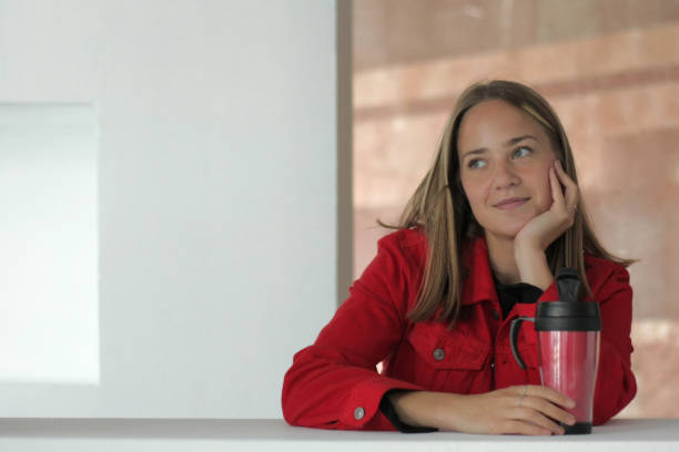 istock Young woman drinking coffee 1045945508