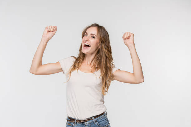istock Winning success woman happy ecstatic celebrating being a winner. Dynamic energetic image of female model 1045945790