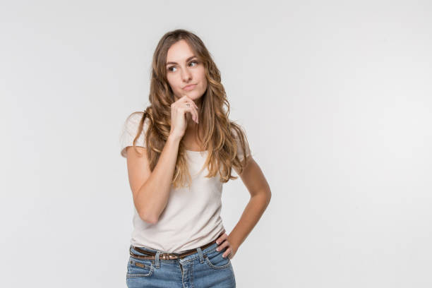 istock Young serious thoughtful business woman. Doubt concept. 1045945816