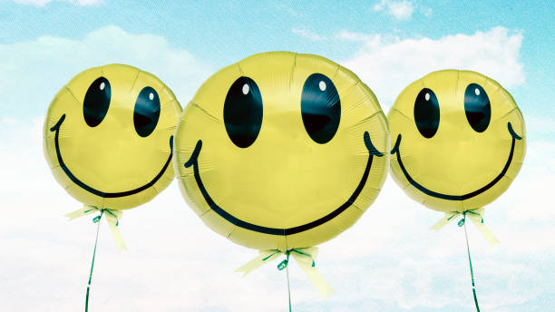 istock three happy ballons on a postcard blus sky 1045946248