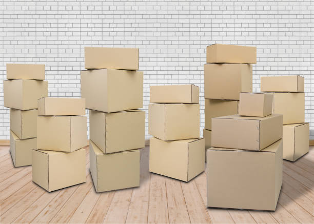 istock Moving in new home. Empty room with Carton boxes 1045953788