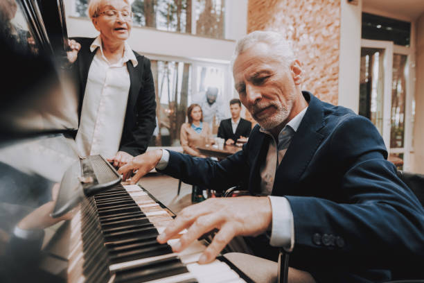 istock Elderly Man. Plays the Piano. Nursing Home. Smile 1045957230