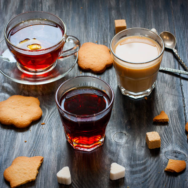 istock Black tea, milk tea, lemon tea in glass cups on a wooden table, selective focus 1045960990