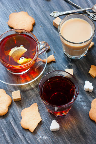 istock Black tea, milk tea, lemon tea in glass cups on a wooden table, selective focus 1045961002