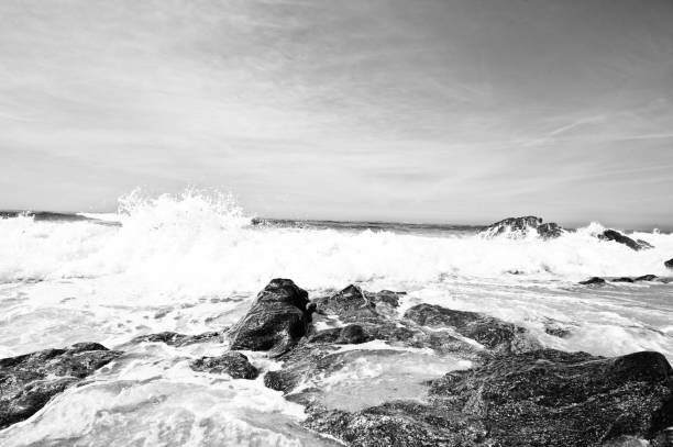 istock Atlantic Ocean Seaside Beach: Beautiful Dramatic Splash Of Tidal Waves Hitting Rocks. Monochrome (Black And White) 1045961778