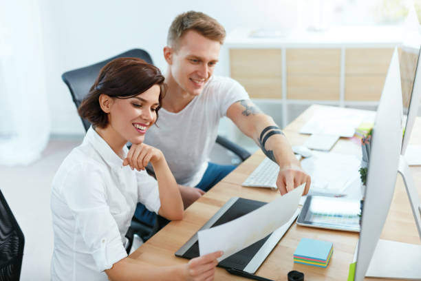 istock Team Of People Working On Computer In Office 1045965394