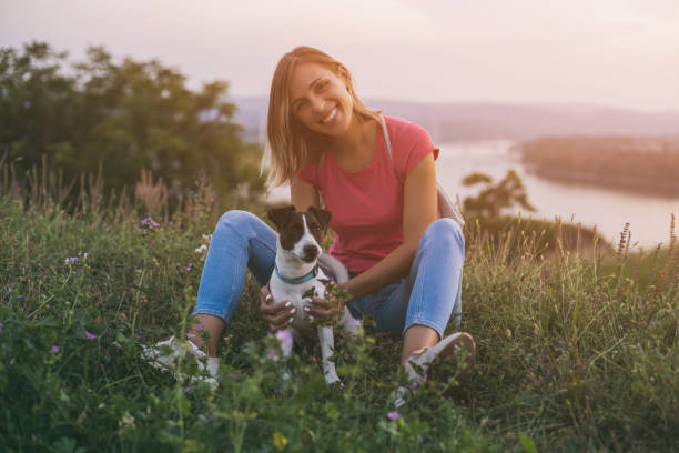 istock Woman with her dog Jack Russell Terrier 1045972754