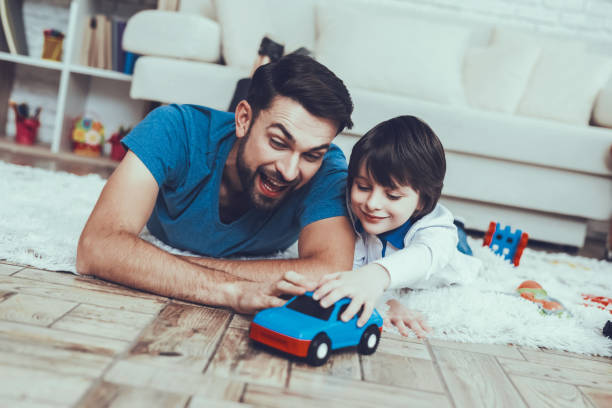istock Smiling Kid. Father. Leisure Time. Man. Smile. 1045975302