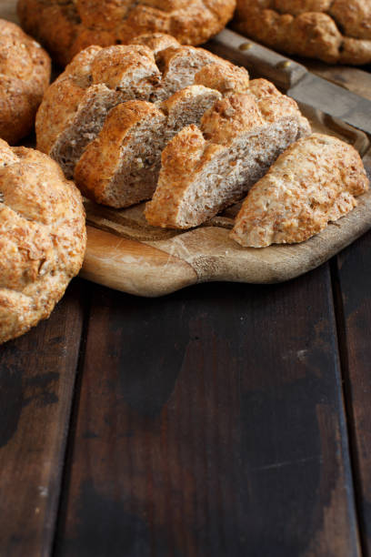 istock Whole wheat bread on a Wooden Table 1045981994