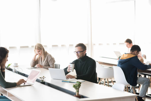 istock Modern Businesspeople in Open Space Office 1045982176