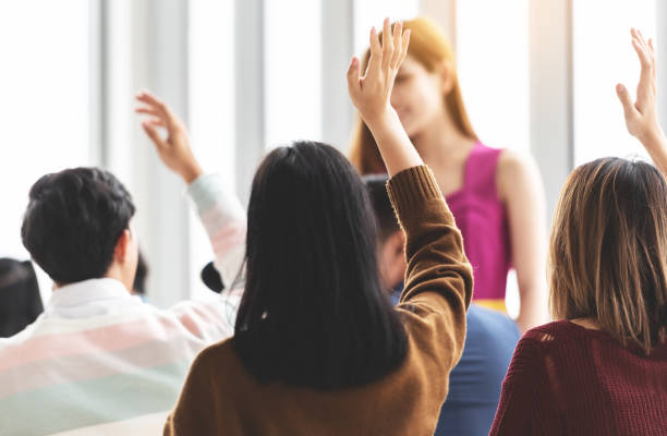 istock Group of young people Raising Hands Up. 1045982374