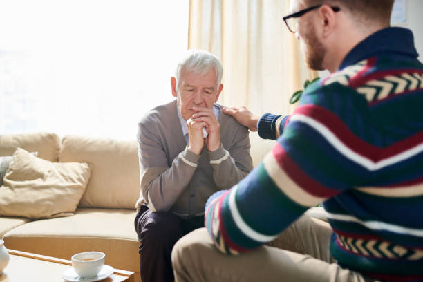 istock Psychologist Comforting Senior Man 1045983714