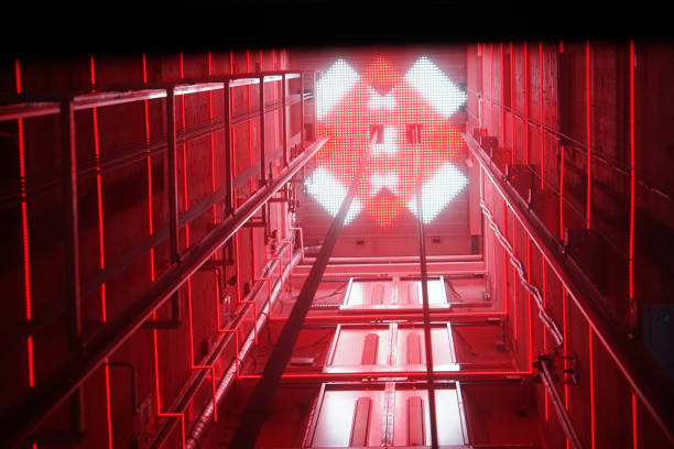 Modern elevator shaft interior with cables and tracks